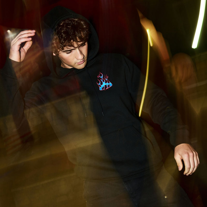 Lifestyle shot of a model wearing a Troy lee Designs fleece pullover sweatshirt.