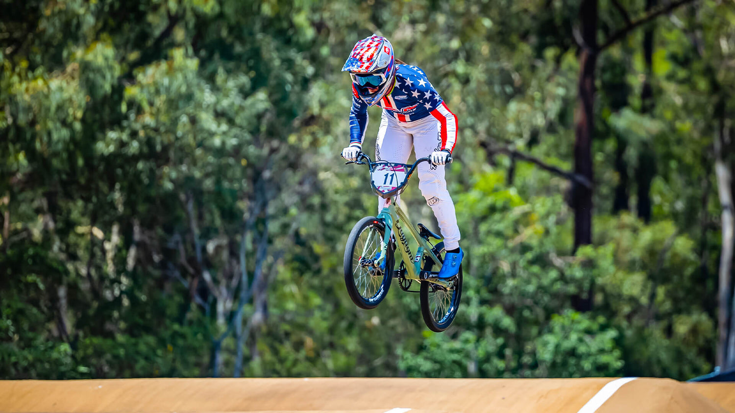 BMX rider in SE Ultra gear going over a jump
